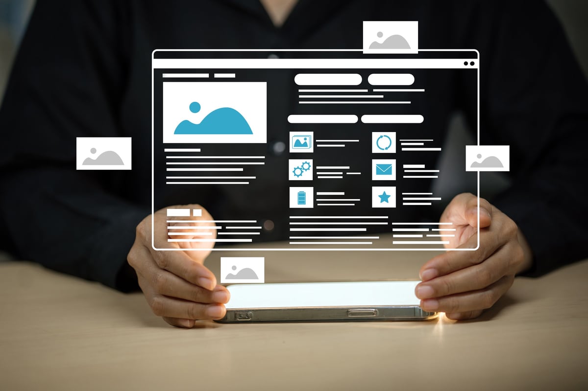 A person holds a smartphone displaying a futuristic website interface with icons and images floating above the device